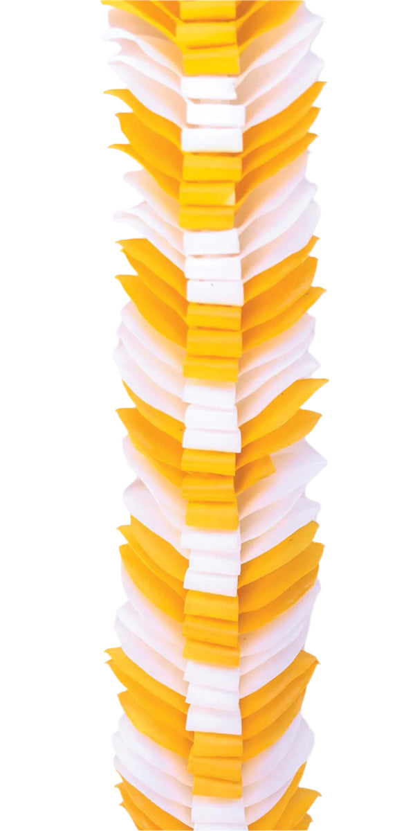Close-up of the white and yellow butterfly lei showing intricate loops in the center and flared orchid petals along the edges.
