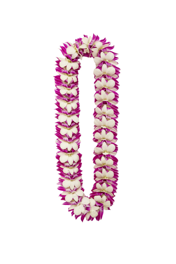 A flat deluxe lei made of orchids, featuring purple and white blossoms arranged with overlapping and folding techniques for an intricate, elegant design, displayed against a white background.