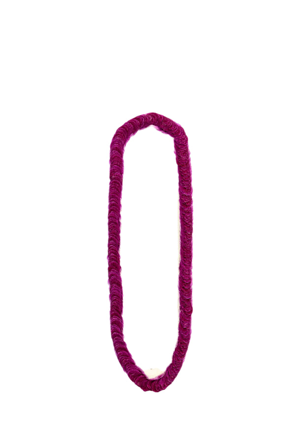 Backside view of the Hana Bom/White lei, revealing the side with all purple orchid petals.