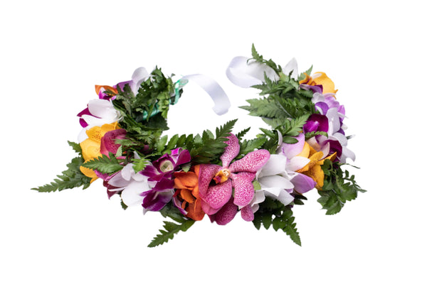 Multicolor orchid and green fern head lei displayed on a white background.