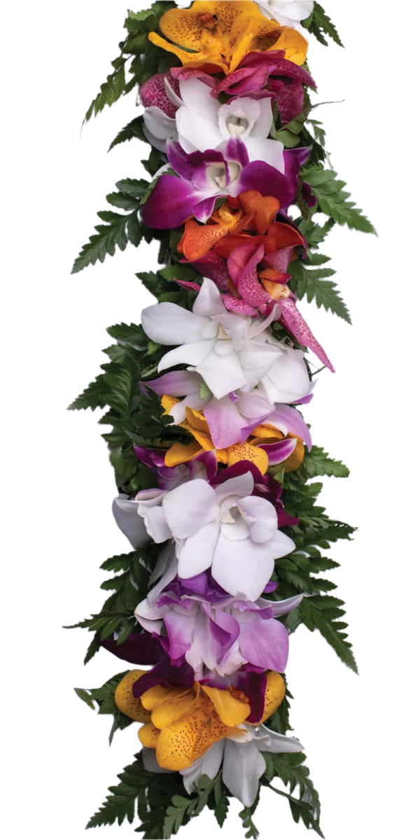 Close-up of a head lei made with different colored orchids and green fern leaves, showing the delicate floral and foliage details against a white background.