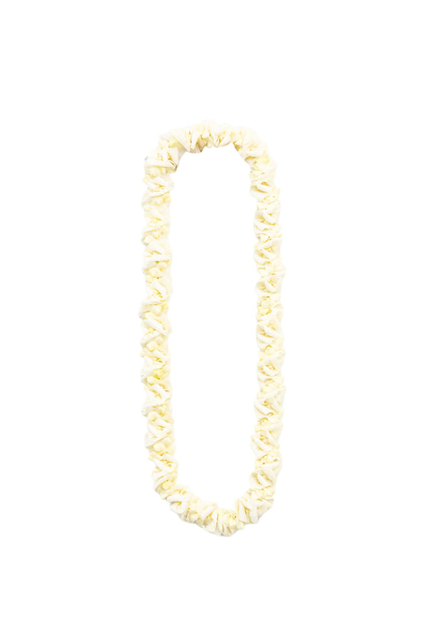 White lei made of crisp white orchid blossoms, incorporating all parts of the flower—from delicate petals to the stiffer centers—for a distinctive and textured appearance.