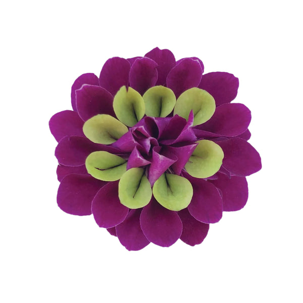 Purple and jade green orchid petals sewn together to form a single flower, displayed on a white background.