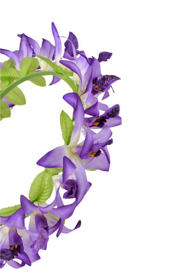 Close-up of a 20-inch children’s silk Lei Po‘o head lei with purple flowers and green leaves, showing the detailed floral arrangement and texture.