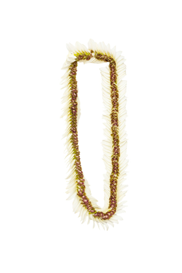 Flat deluxe lei featuring jade orchid petals in the center and white orchid petals on the outer edges in a patterned design.