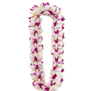 A lei made of white, pink, and purple orchid blossoms arranged in a full, layered style, creating a lush and colorful floral design.