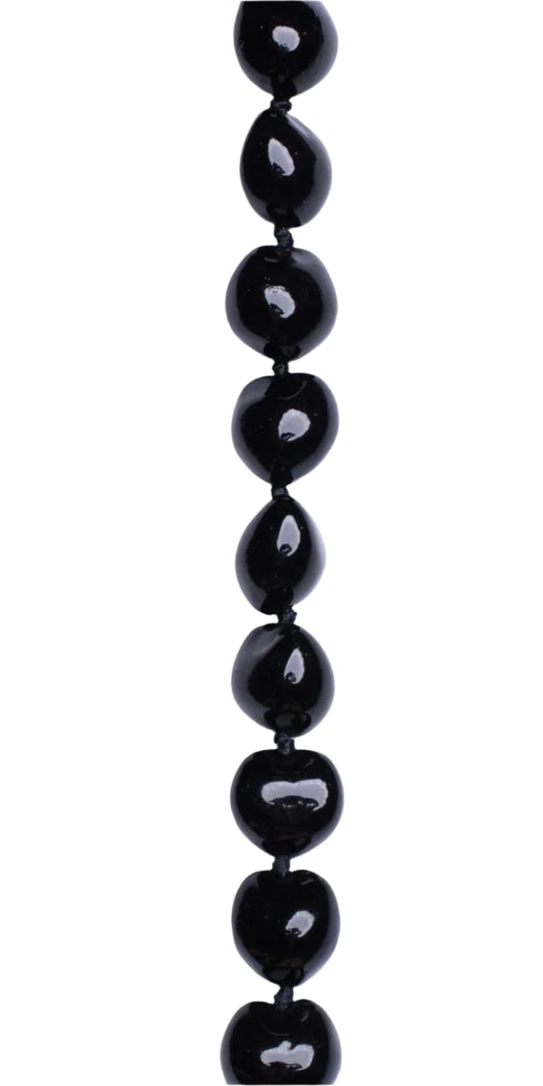 Black kukui nut lei close-up with a smooth, glossy finish.