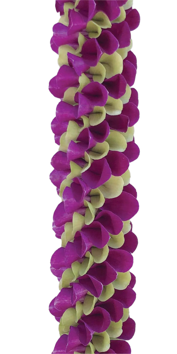 Close-up of a spiral orchid lei with purple and jade green petals arranged in a striking alternating diagonal pattern, set against a white background.