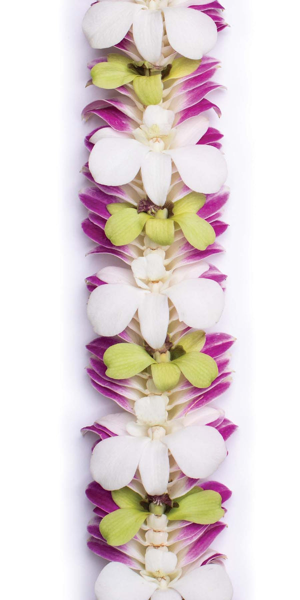 Close-up of a lei showcasing purple orchid petals on the edges with alternating jade green and white petals inside, highlighting the color contrast and layered floral arrangement.