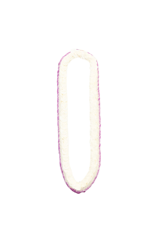 Flat, featherlike lei composed of 900 purple and white orchid petals densely layered to create a soft, textured appearance.