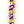 Close-up of a colorful lei showing purple and green orchid accents, with white petals dramatically flaring around the edges for a bold, layered look.