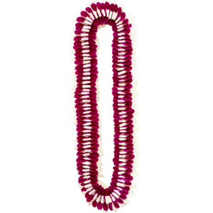 A lei made of deep purple and white orchid petals laid out flat in a layered design, displayed against a white background.