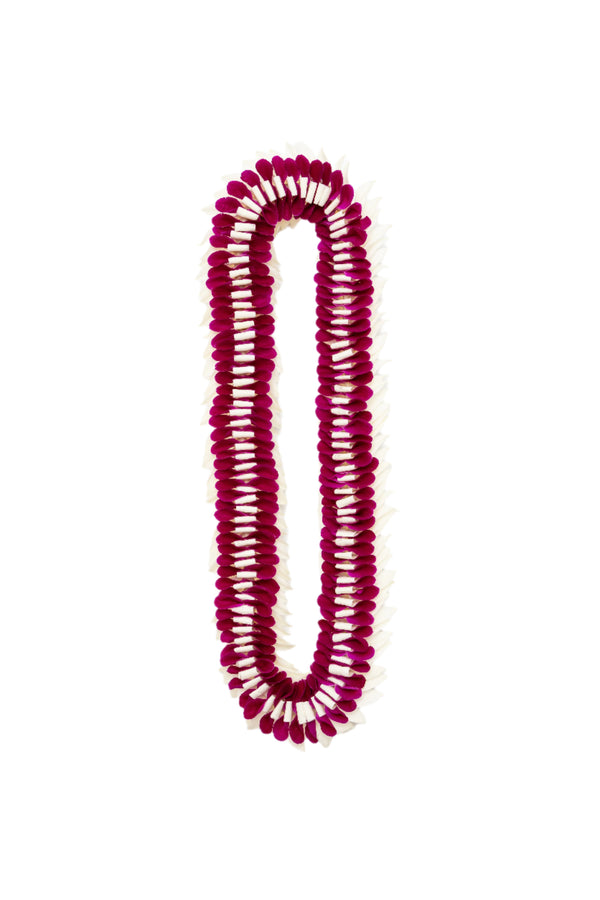 A lei made of deep purple and white orchid petals laid out flat in a layered design, displayed against a white background.