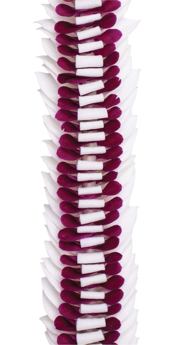 Close-up of the deep purple and white orchid lei showing the contrast between the rich purple petals and soft white ones arranged in a flared, dimensional pattern.