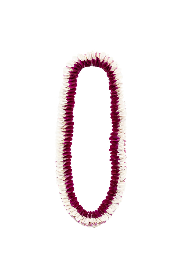 Lei made of fresh orchid petals, with white on the outer edges and purple on the inner side, forming an almost bow-like pattern, displayed against a white background.