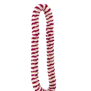 Purple premium spiral orchid lei featuring an intricate pattern with small sections of purple petals alternating with larger sections of the light-colored backing of orchid blossoms.