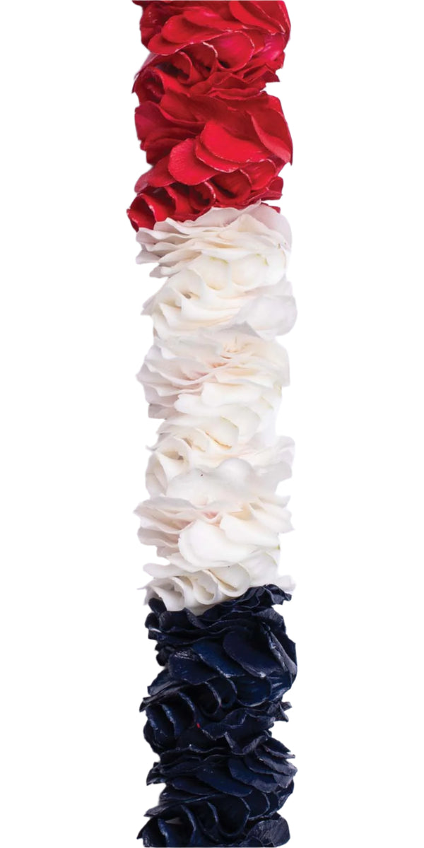Close-up of a premium spiral orchid lei with natural white and sprayed red and blue petals arranged in large alternating sections, showcasing the intricate pattern and vibrant colors.