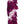 Close-up of a premium lei showcasing purple orchid petals interspersed with the firm nose parts of the blossoms, arranged in an alternating diagonal spiral pattern highlighting texture and detail.