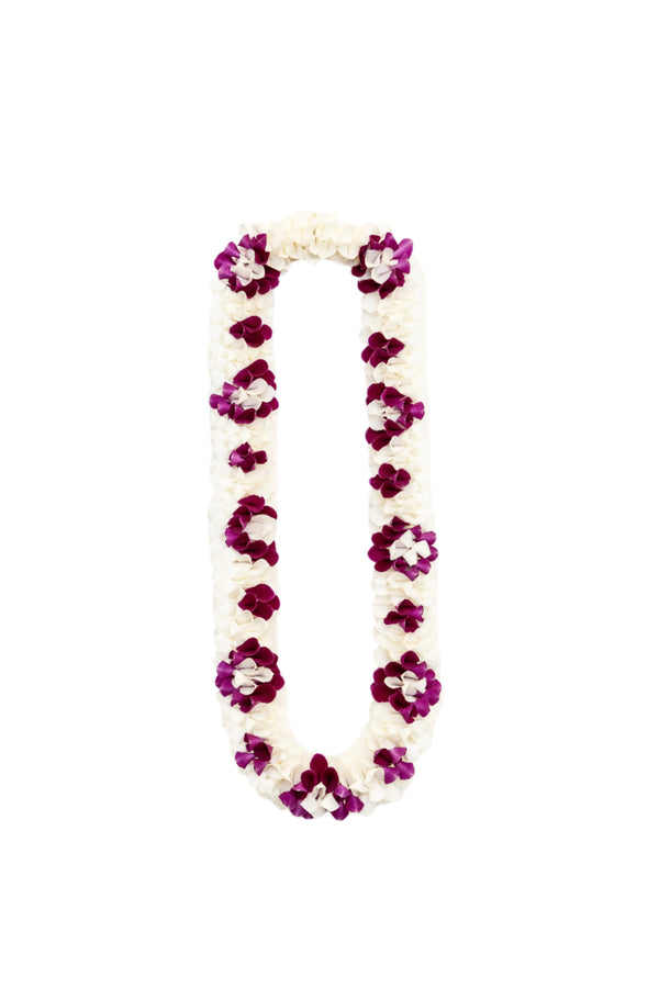 Premium spiral orchid lei featuring white petals accented by clusters of purple petals arranged in a diamond-like pattern.
