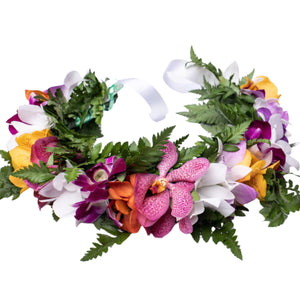 Multicolor orchid and green fern head lei displayed on a white background.