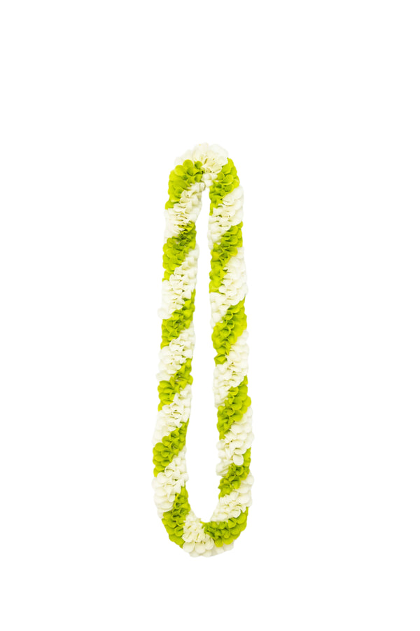 Spiral lei made of orchids featuring alternating diagonal stripes of green and white petals.