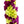 Close-up of a floral lei showing fresh orchids in jade green and deep plum purple, intricately arranged in a detailed crisscross pattern with visible petal texture.