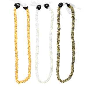 Collection of three leis made from mongo shells in pure yellow, white, and green, each adorned with two Kukui nuts and tied with a ribbon at the end.