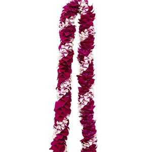 A spiral lei made of Dendrobium orchids in varying shades of purple, arranged in an alternating diagonal pattern and laid out on a white background.