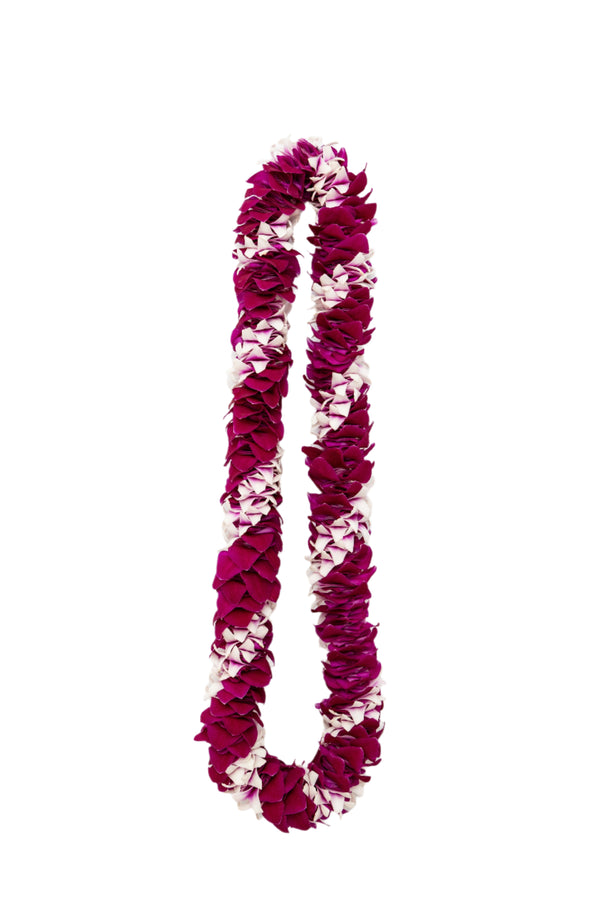 A spiral lei made of Dendrobium orchids in varying shades of purple, arranged in an alternating diagonal pattern and laid out on a white background.