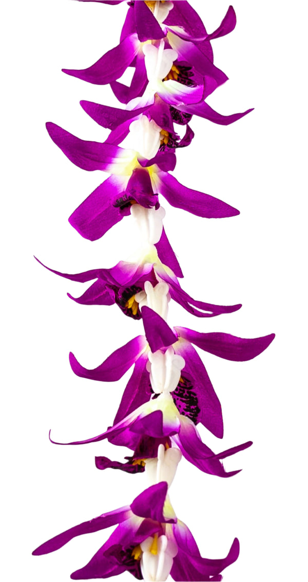 Close-up of a lei featuring silk fuchsia orchids combined with white plastic crown flowers, showing layered textures and soft colors.