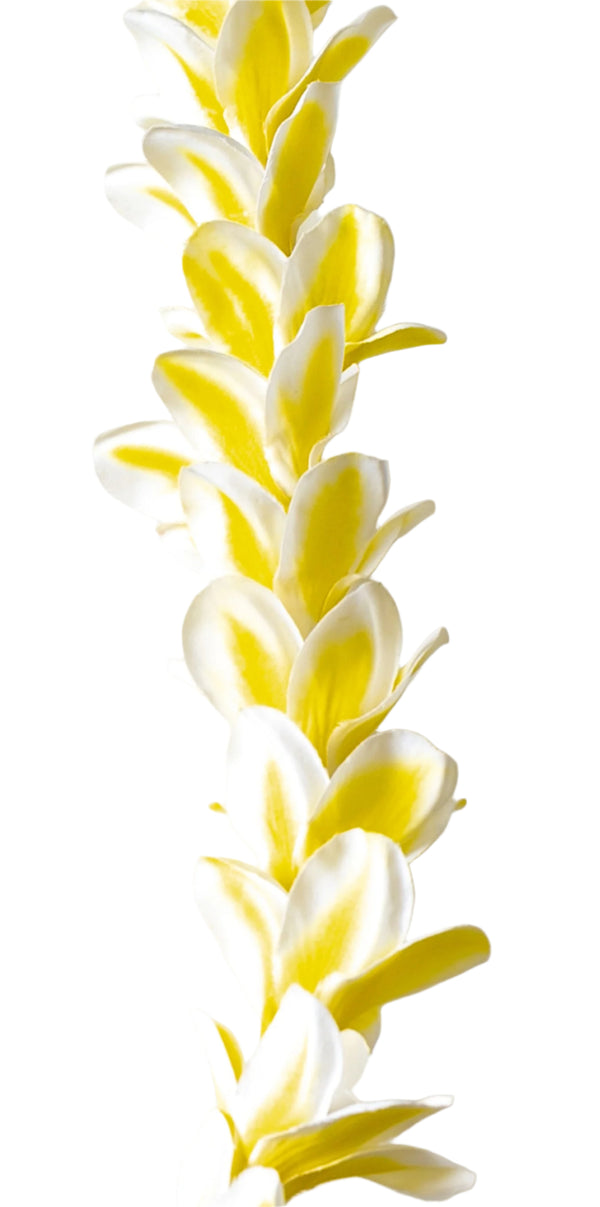 Close-up of a yellow lei featuring silk plumeria flowers, highlighting the soft texture and petal details against a white background.