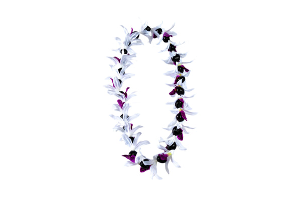 Lei made of silk white orchids with purple centers and black kukui nuts, displayed against a white background.