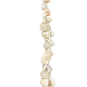 A lei made of Umbonium shells, also known as 'button shells', strung together, placed on a white background. 