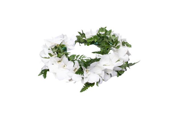 White orchid and green fern head lei displayed on a white background.